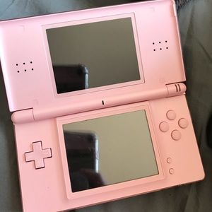 Pink Nintendo DS with bag bag and games
